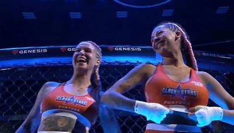 Female fighters flash breasts to crowd following tag ...